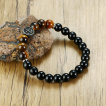 Bracelet homme en perles noires et Oeil de Tigre  croix