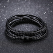 Bracelet homme style écrou à tresses et lanières de cuir noir