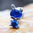 Piercing cartilage  lapin de zirconiums clairs et bleus