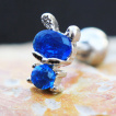 Piercing cartilage  lapin de zirconiums clairs et bleus