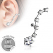 Piercing cartilage oreille avec toile suivie de 5 strass