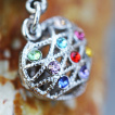 Piercing nombril cage en coeur  pierres multicolores