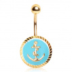 Piercing nombril dor  ancre marine sur fond bleu