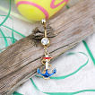 Piercing nombril doré avec ancre de marine bleu blanc rouge