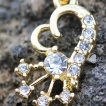 Piercing nombril doré à coeur et étoile éclatée