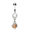 Piercing nombril étoile de mer sur coquillage