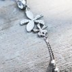 Piercing nombril fleurs à oeil de chat, chaine et perles