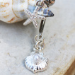 Piercing nombril inversé à étoile de mer et coquillage à perle