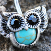 Piercing nombril petite chouette en vol avec Turquoise