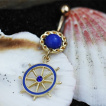 Piercing nombril plaqu or et bleu  barre (roue) de bateau