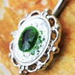 Piercing nombril style miroir ancien à strass vert et clairs