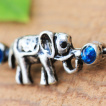 Piercing oreille industriel éléphant et pierres bleues