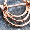 Piercing téton cuivré à design style branches
