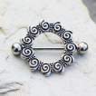 Piercing téton style antique à spirales