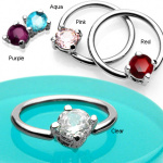 Piercing anneau captif serti d'une pierre ronde