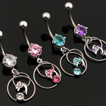 Piercing nombril double-anneau et dauphin