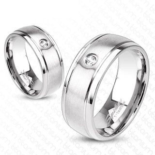 Bague couple titane  bandeau central bross et serti