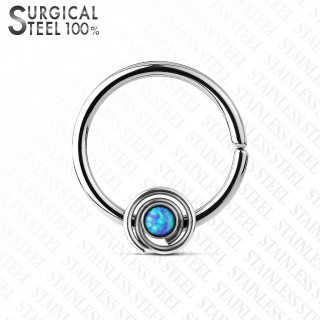 Piercing anneau acier opale bleue au centre d'une spirale