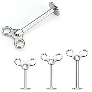 Piercing clé de remontage (lèvre, cartilage)