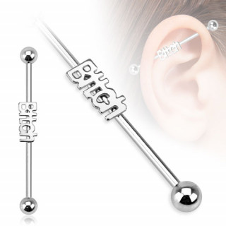 Piercing industriel avec mot "Bitch" en relief