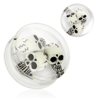 Piercing plug transparent renfermant des têtes de morts